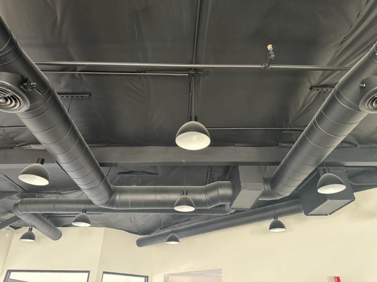 Spiral duct system installed across a commercial ceiling.