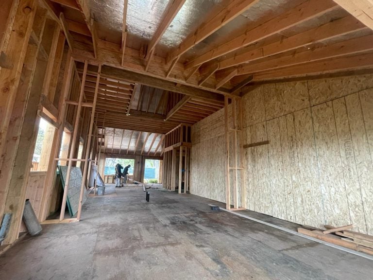 Wood framed home addition interior ready for HVAC rough in.