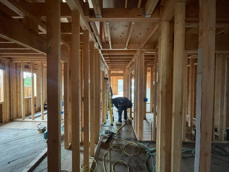 Home framing in progress in Tracy CA during HVAC installation.