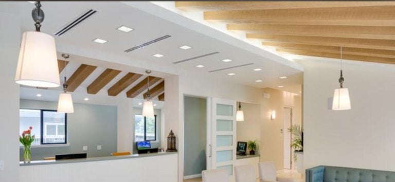 Modern home interior with linear slot air vents for a concealed HVAC system.