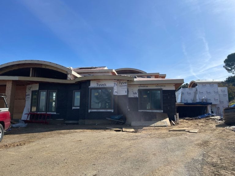 Custom home under construction in Tracy CA awaiting HVAC installation.